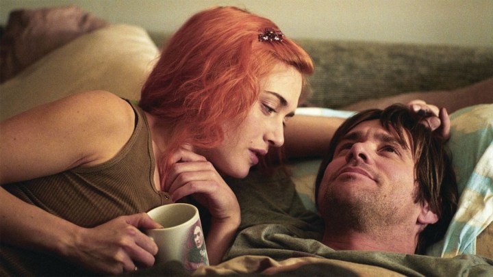 Kate Winslet and Jim Carrey cuddling together in a bed in Eternal Sunshine of the Spotless Mind.