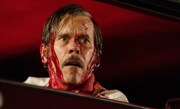 A bloodied man looks worried in MaXXXine.